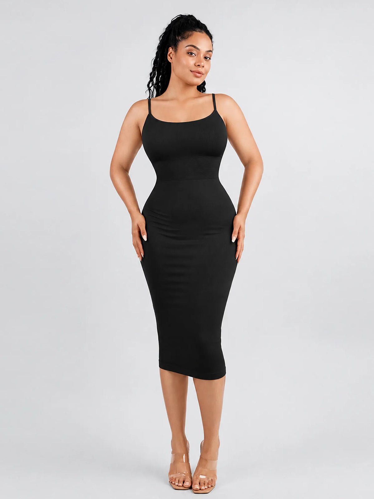 Front view of a model in a black seamless shaping cami midi dress featuring built-in bra and tummy light compression